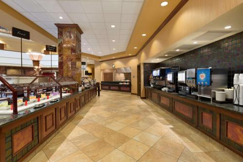 a shopping mall with a food counter in a store at Embassy Suites by Hilton Dallas Frisco Hotel & Convention Center in Frisco