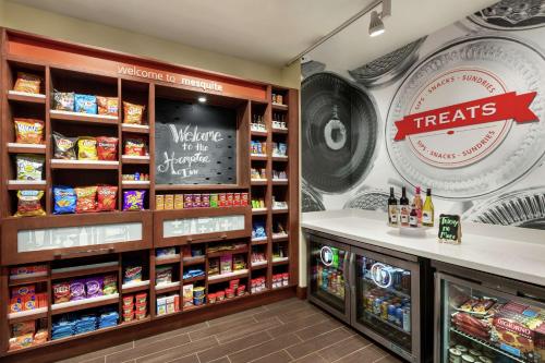 a grocery store with a sign that reads welcome to our shop at Hampton Inn & Suites Dallas-Mesquite in Mesquite