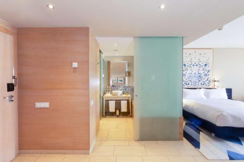 Ένα ή περισσότερα κρεβάτια σε δωμάτιο στο Hilton Vilamoura
