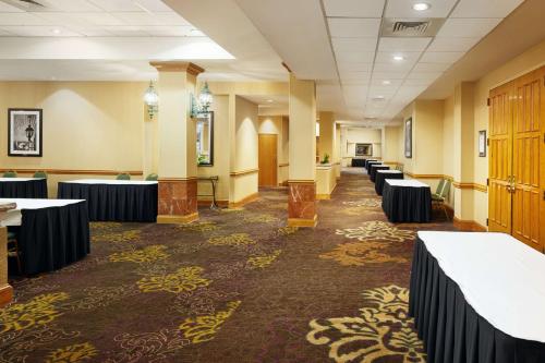 a conference room with tables and chairs in it at Embassy Suites by Hilton Greensboro Airport in Greensboro