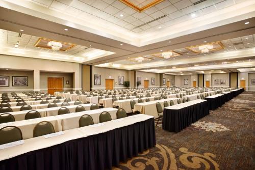 a large room with rows of tables and chairs at Embassy Suites by Hilton Greensboro Airport in Greensboro