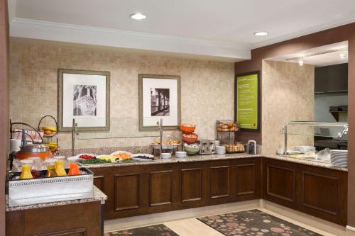 a kitchen with a counter with food on it at Hilton Garden Inn Shelton in Shelton