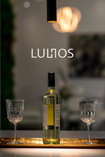 a bottle of wine and two glasses on a table at Oasis with Pool Spa Games 5BR L21 in Miami Gardens