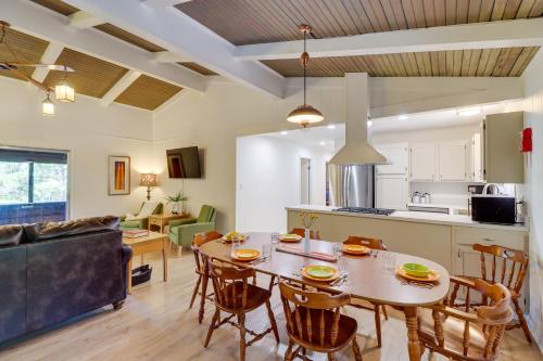 a kitchen and living room with a table and chairs at Greers Ferry Hideaway Lake View, Boat Ramp Access in Fairfield Bay