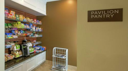 a pharmacy aisle with a pharmacyacistacistacistacistacist at Hilton Garden Inn Macon/Mercer University in Macon