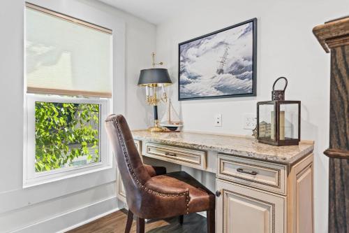 a home office with a desk and a chair at Historic Simmons Estate sleeps 20 in Williamstown