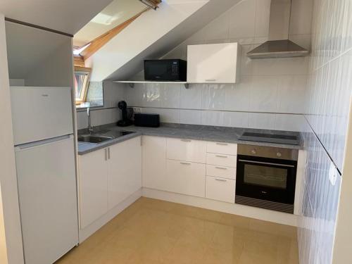 Dapur atau dapur kecil di APARTAMENTO MARISMAS DA LANZADA- Playa de La Lanzada