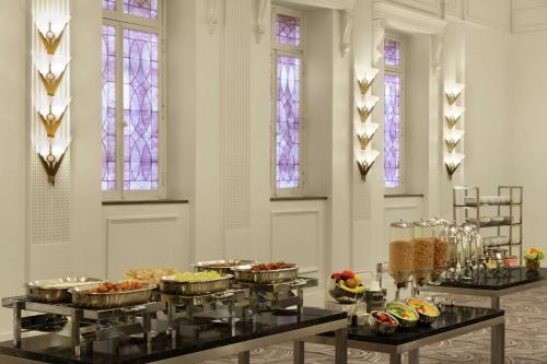 a room with a bunch of food on display at Hilton New Orleans / St. Charles Avenue in New Orleans
