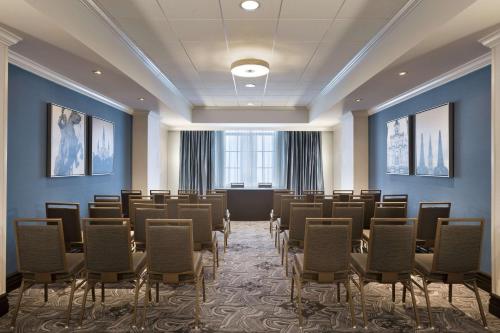 a room with a bunch of chairs and a podium at Hilton New Orleans / St. Charles Avenue in New Orleans