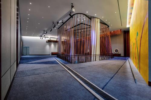 a hallway with a large gate in a building at Conrad New York Downtown in New York