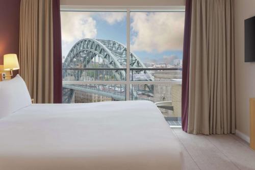 a hotel room with a view of the sydney harbour bridge at Hilton Newcastle Gateshead in Newcastle upon Tyne