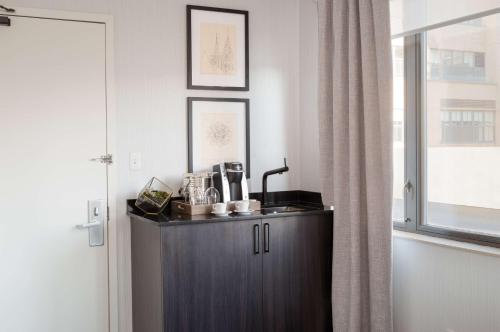 a kitchen with a cabinet and a window at Hilton Garden Inn New York/Tribeca in New York