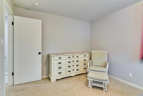 a bedroom with a dresser and a chair in it at Serene Forest Grove Home with Deck and Stunning Views! in Forest Grove