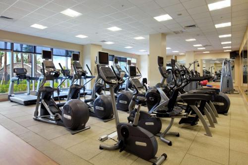 a gym with a lot of treadmills and exercise bikes at Signia by Hilton Orlando - An Official Walt Disney World Hotel in Orlando