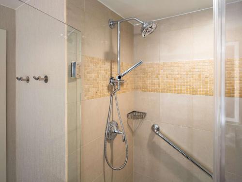 a bathroom with a shower with a glass door at Signia by Hilton Orlando - An Official Walt Disney World Hotel in Orlando