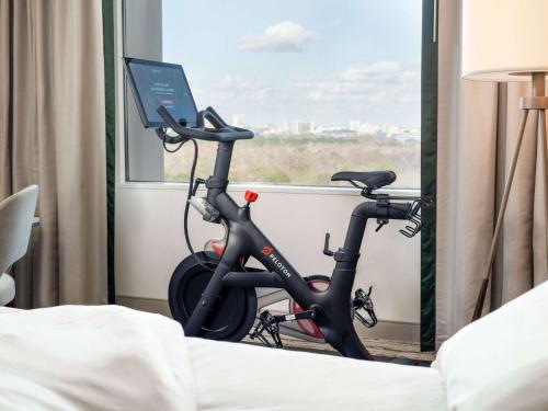 a bike parked in a room with a window at Signia by Hilton Orlando - An Official Walt Disney World Hotel in Orlando