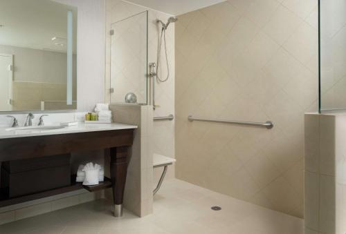 a bathroom with a sink and a shower at Signia by Hilton Orlando - An Official Walt Disney World Hotel in Orlando