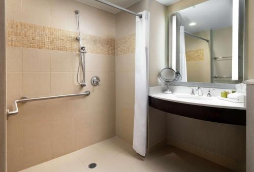 a bathroom with a sink and a shower at Signia by Hilton Orlando - An Official Walt Disney World Hotel in Orlando