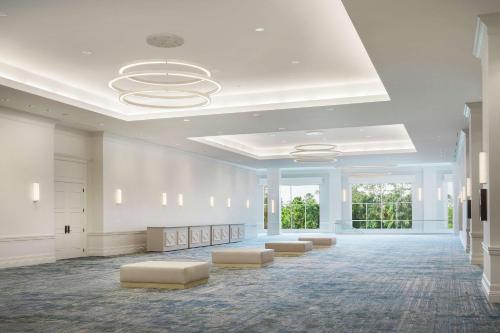 a large room with a lobby with couches and windows at Signia by Hilton Orlando - An Official Walt Disney World Hotel in Orlando