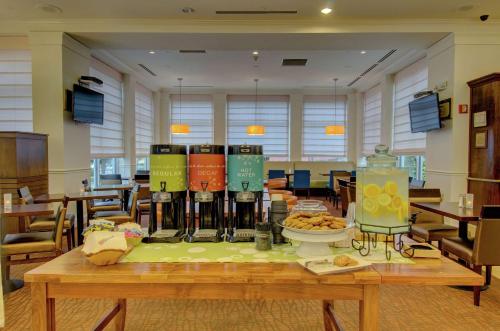 a table with a bunch of bottles of wine on it at Hilton Garden Inn Norwalk in Norwalk