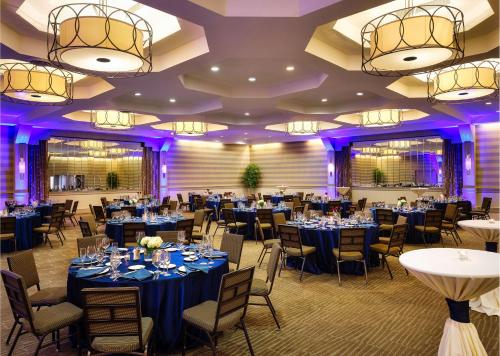 a banquet room with tables and chairs and purple lighting at DoubleTree by Hilton Hotel Philadelphia Center City in Philadelphia
