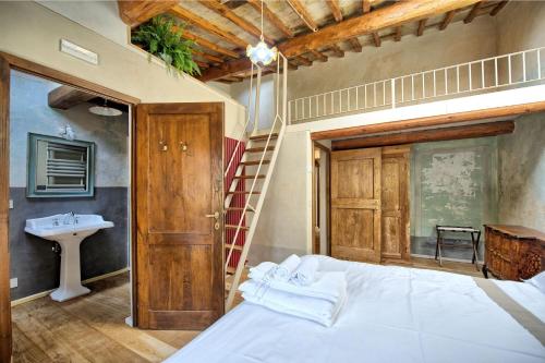 מיטה או מיטות בחדר ב-La Pimpinella di Semifonte