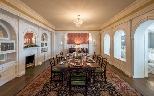 a dining room with a long table and chairs at The Strathallan - a DoubleTree by Hilton in Rochester