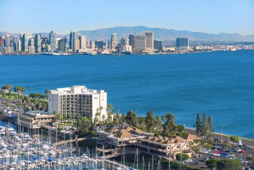 an aerial view of a city and a harbor with boats at Hilton San Diego Airport/Harbor Island in San Diego