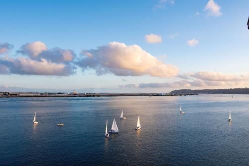 a group of sailboats on a large body of water at Hilton San Diego Airport/Harbor Island in San Diego
