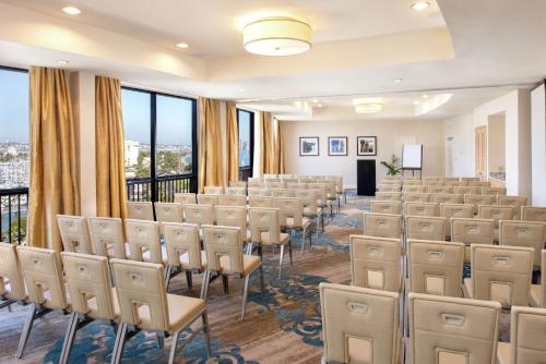 a room with rows of chairs and a podium at Hilton San Diego Airport/Harbor Island in San Diego