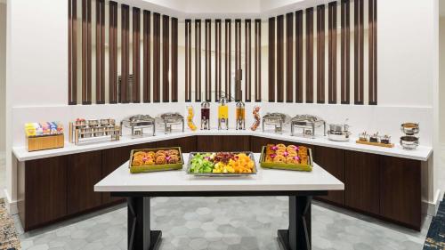 a counter with three trays of fruit on a table at DoubleTree by Hilton San Diego Del Mar in San Diego