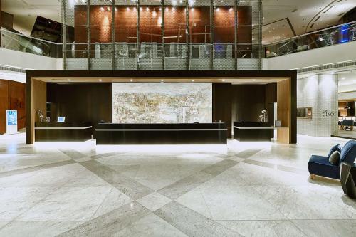 a lobby with a large screen in a building at Hilton Sao Paulo Morumbi in São Paulo