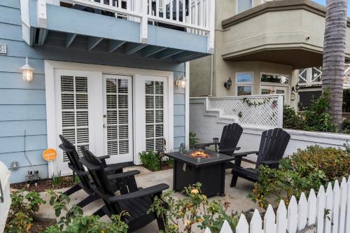 a patio with chairs and a table on a house at 256 Americana in Huntington Beach