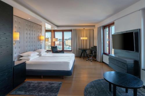 a hotel room with a bed and a television at Hilton Stockholm Slussen Hotel in Stockholm