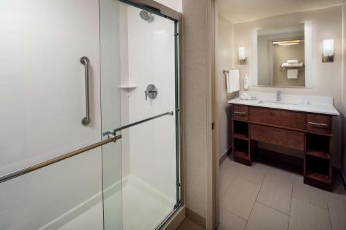 a bathroom with a shower and a sink at Homewood Suites by Hilton Wallingford-Meriden in Wallingford