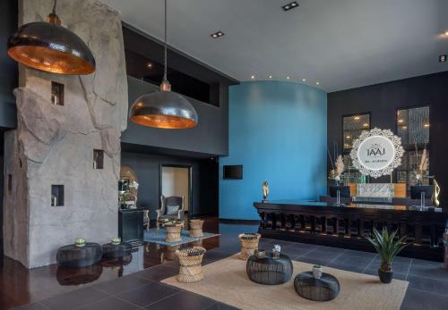 a lobby of a restaurant with a barber shop at Hilton Evian Les Bains in Évian-les-Bains