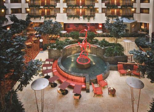 an aerial view of a hotel lobby with a fountain at Embassy Suites Northwest Arkansas - Hotel, Spa & Convention Center in Rogers
