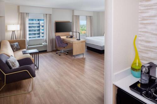 a hotel room with a bed and a desk at Hampton Inn & Suites by Hilton Miami Downtown/Brickell in Miami