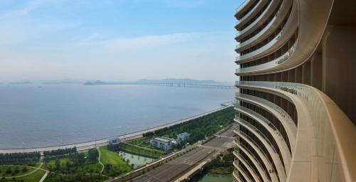 a view of the ocean from a tall building at Hilton Zhoushan in Zhoushan