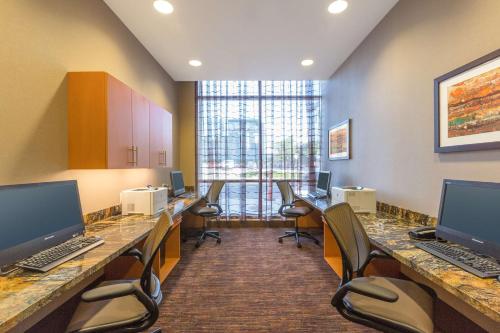 a room with two desks and chairs with computers on them at Hampton Inn Houston Downtown in Houston