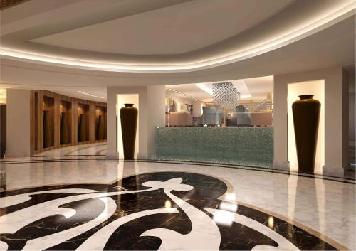 a lobby with a symbol on the floor of a building at Conrad Makkah in Mecca