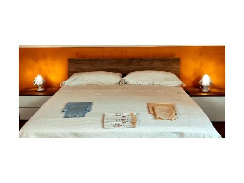 Un pat sau paturi într-o cameră la La Suite di Florì