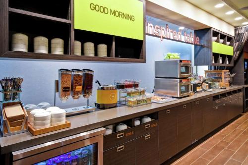 a kitchen with a counter with some food on it at Home2 Suites By Hilton Smyrna Nashville in Smyrna