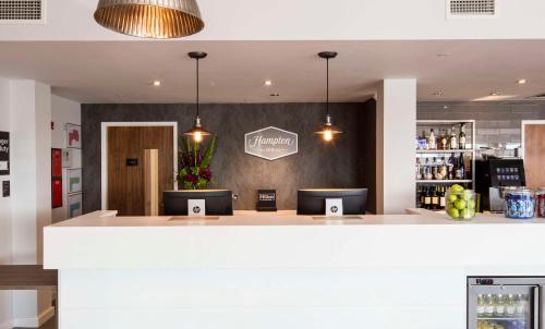 a bar in the lobby of a restaurant at Hampton By Hilton Humberside Airport in Kirmington