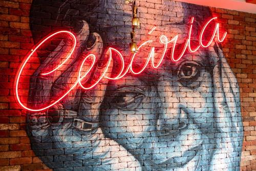 a neon sign that reads la corona on a brick wall at Hilton Cabo Verde Sal Resort in Santa Maria