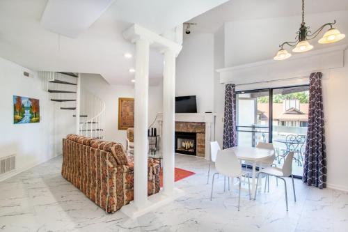 a living room with a couch and a table at Serene Views Community Pool in Gatlinburg