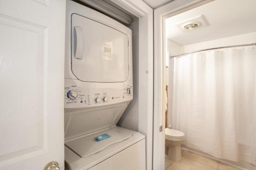 a bathroom with a washing machine and a toilet at Serene Views Community Pool in Gatlinburg