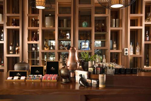 a bar with a counter with various items on it at DoubleTree by Hilton Weerawila Rajawarna Resort in Weerawila