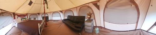 an inside view of a large tent with windows at Al's Hideaway Glamping Tents in Pipe Creek