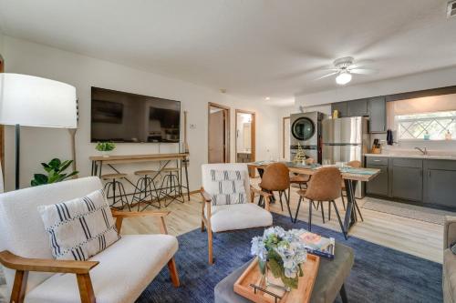 a living room with a couch and a table at 3 Mi to Silver Dollar City! Family Getaway with Pool in Branson